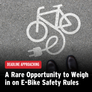 Decal of an e-bike on pavement. Black gradient provides a background for text, labelled "deadline approaching: a rare opportunity to weigh in on e-bike safety rules"