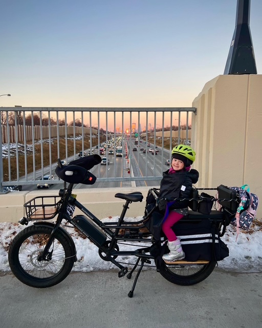 Winter bike commuting in Minneapolis with a young passenger in tow